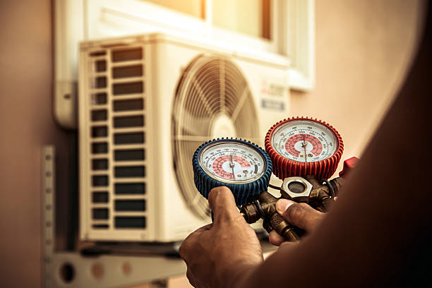 Professional Air Conditioning Service technician working in Pomona, MO